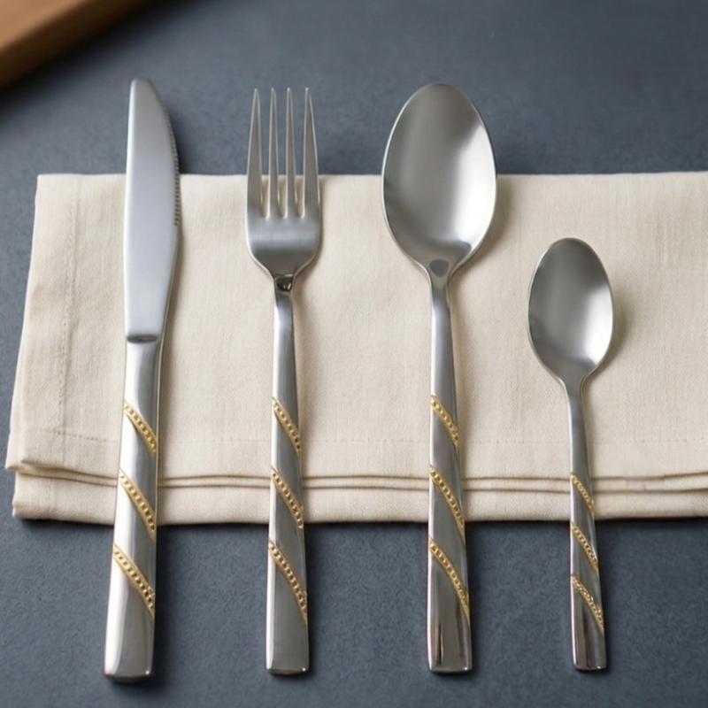 Luxury Stainless Steel Cutlery Set - 24 Pieces with a Gold Spiral Design and Modern Organizer.