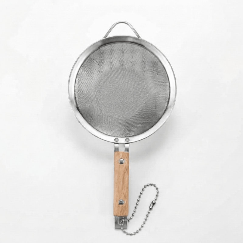 Metal kitchen strainer with fine holes and an elegant wooden handle
