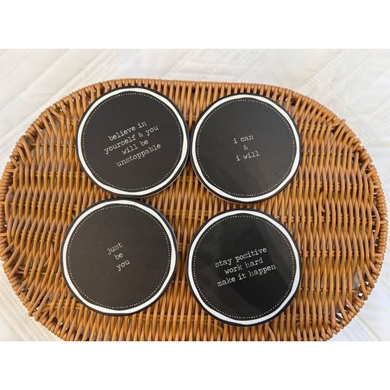 A porcelain coaster 4 pcs set with a plastic holder.
