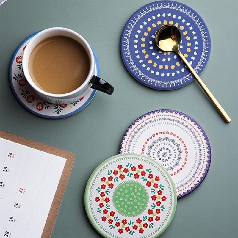 A porcelain coaster 4 pcs set with a plastic holder.