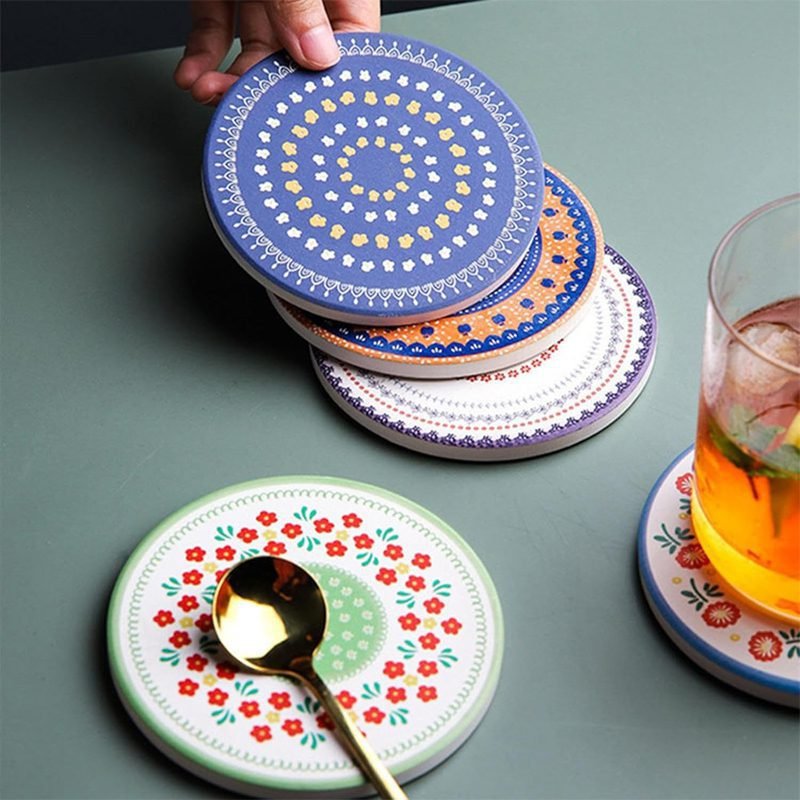 A porcelain coaster 4 pcs set with a plastic holder.