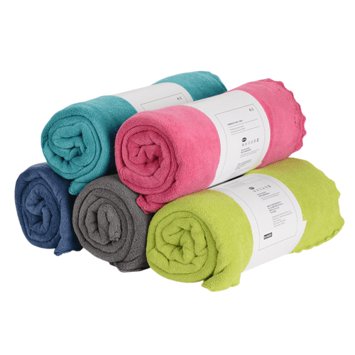 Rolled bath towels in multiple colors displayed together