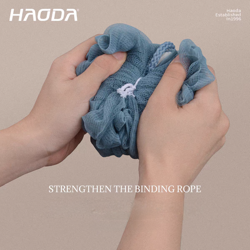 Exfoliating bath sponge with hanging loop